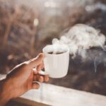 집에서도 가능한 ‘마음 챙김’ 웰빙, 작은 습관이 주는 큰 변화 person holding white ceramic cup with hot coffee